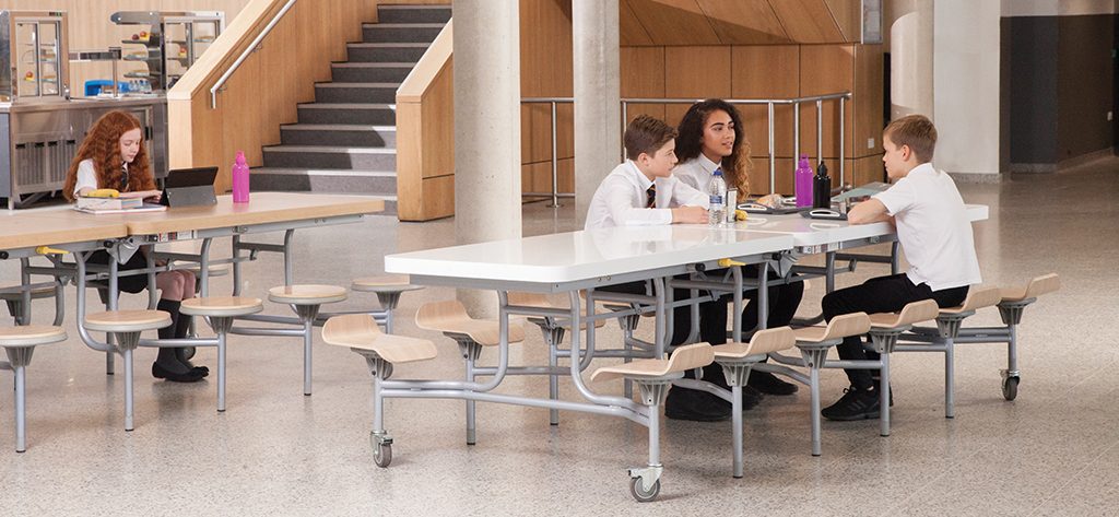 school dining furniture in use in school hall