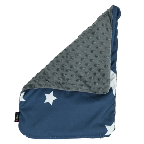 Star print weighted lap pad resting on a child's lap at a classroom desk